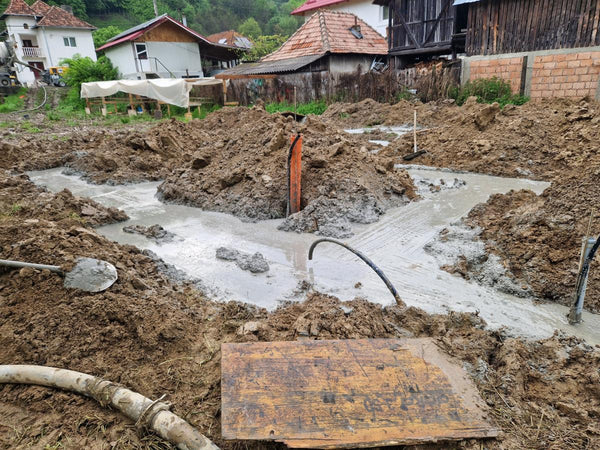 Sapatura mecanizata si turnare beton in talpa fundatie casa metalica 206 mp