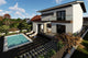 Proiect casa pe structura metalica moderna cu balcoane 052 - fatada de casa cu piatra imagine 2