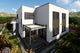 Proiect casa pe structura metalica modern cu garaj dublu 062 - fatada casa cu piatra imagine 2