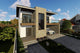 Proiect casa pe structura metalica moderna cu balcoane 052 - fatada de casa cu piatra imagine 3
